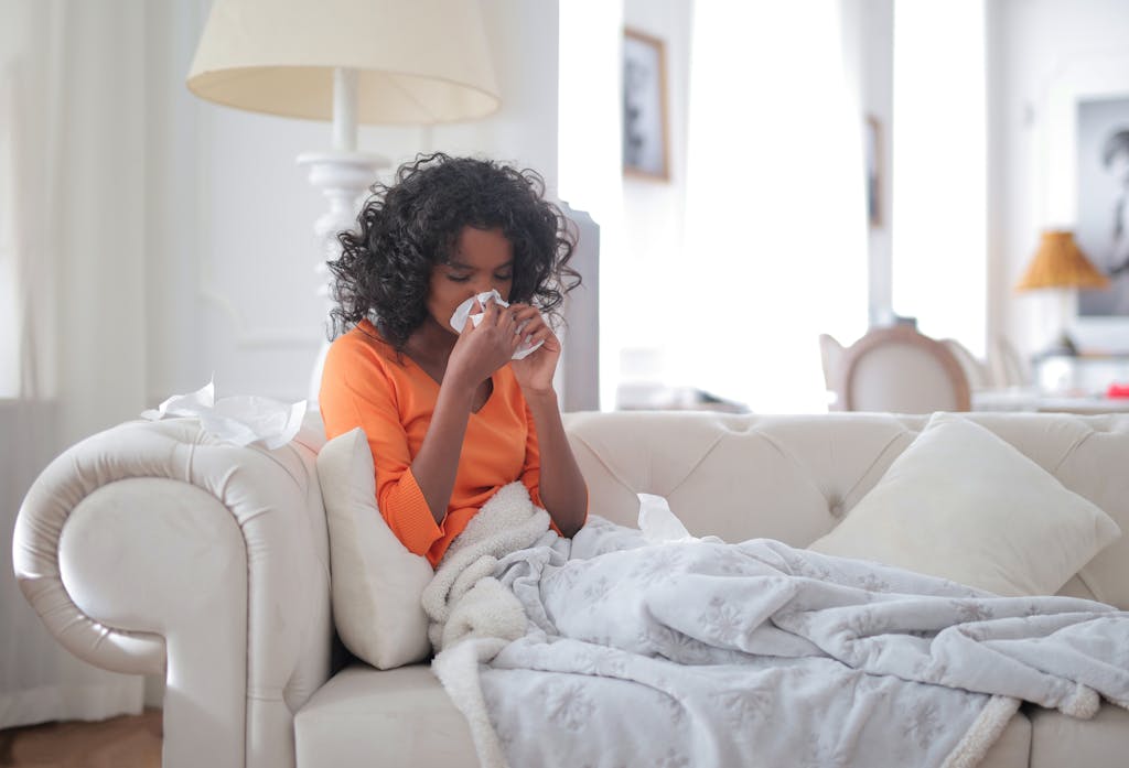 Woman Wiping Her Nose with Tissue