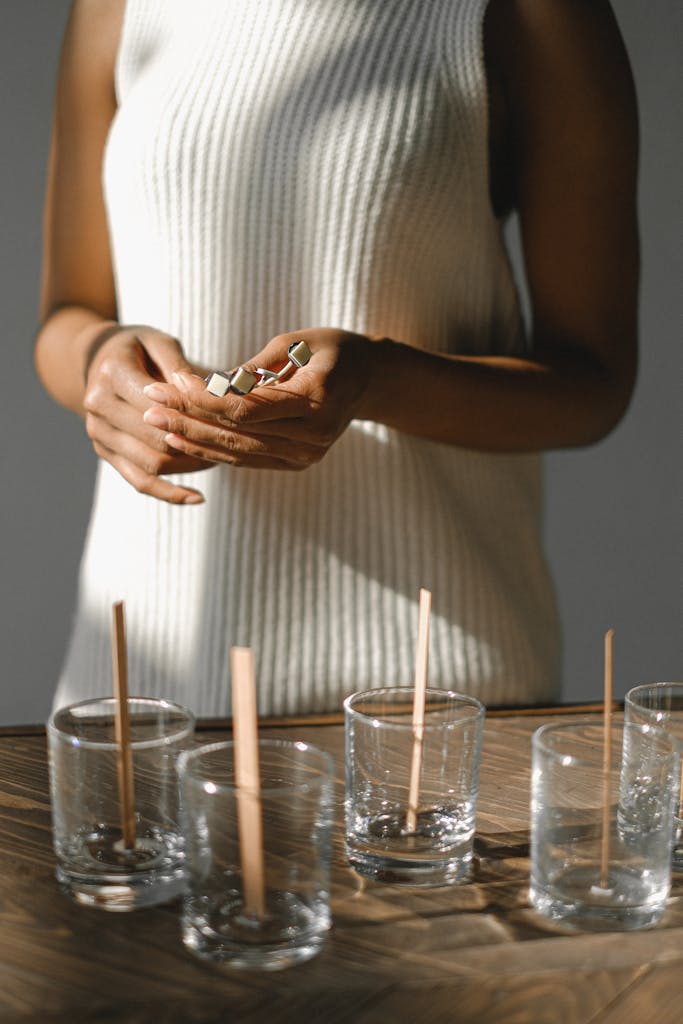 woman with wooden wicks in hands