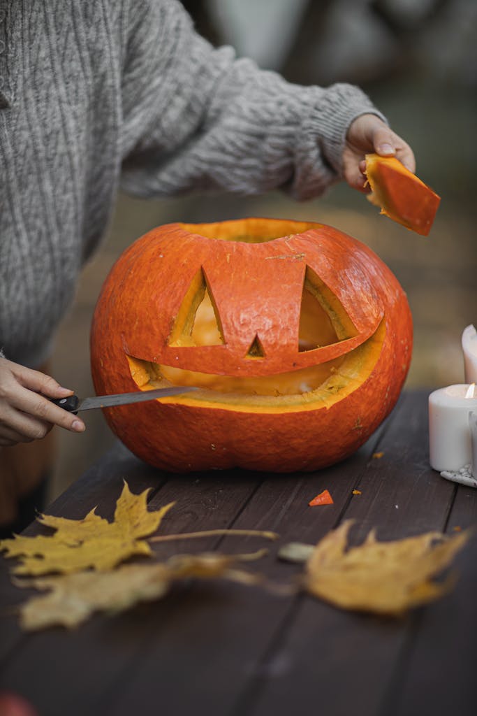 Person carving Jack O Lantern