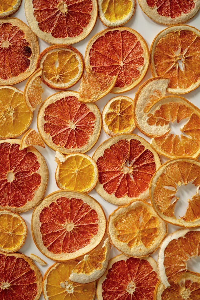 slices oranges on parchment drying