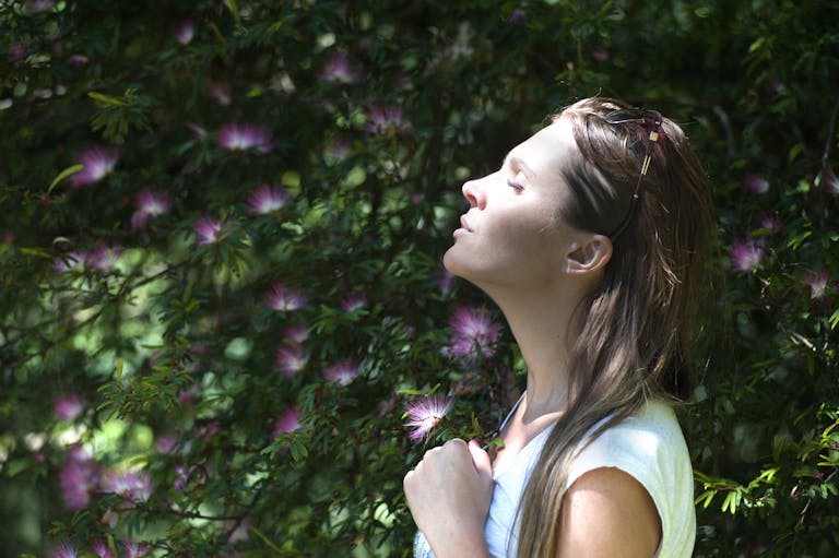 A woman enjoying a serene moment contemplating reclaiming my life